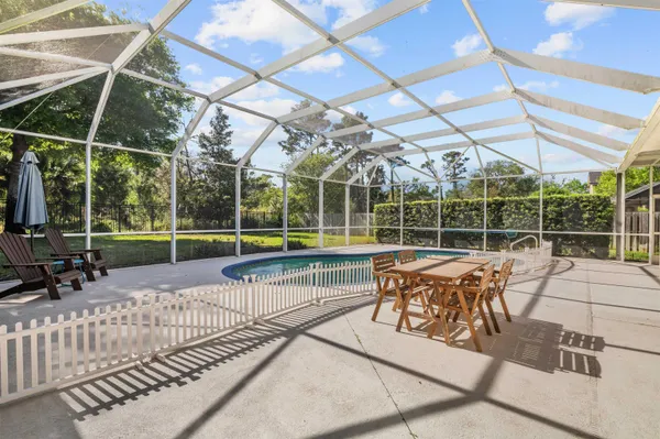 a view of a chairs and table in the patio
