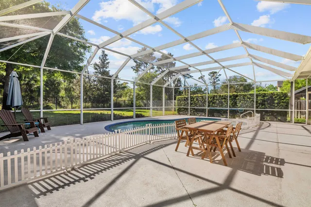 a view of a chairs and table in the patio