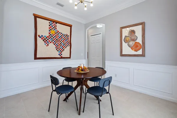a view of a room with furniture and wooden floor