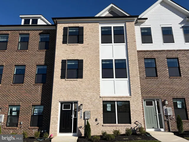 a front view of a house with large windows