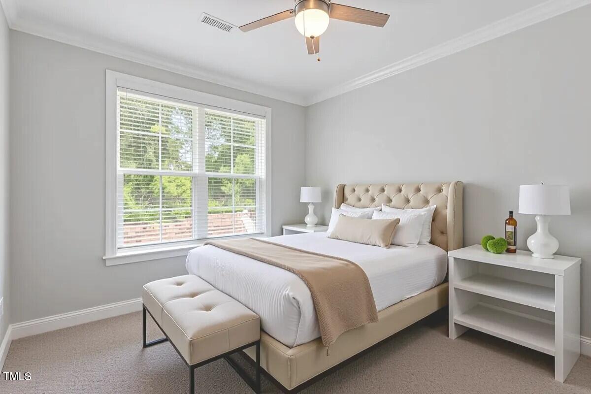 304 White Iris Loop Cary, NC 27519 - Photo 27 of 76 a bedroom with a bed and a window