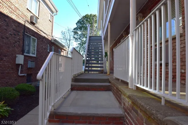 a view of entryway with wooden floor and a yard