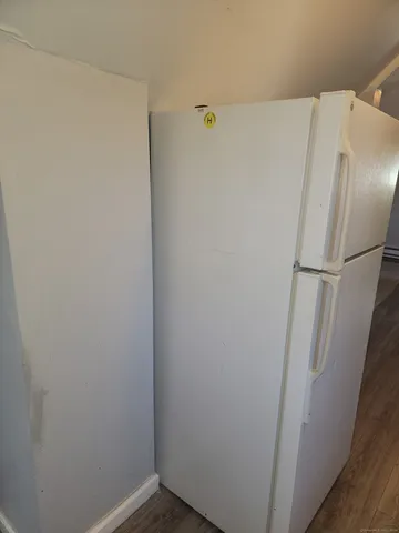 a white refrigerator freezer and a dishwasher
