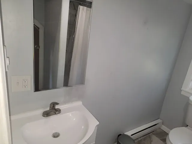 a bathroom with a sink and a toilet