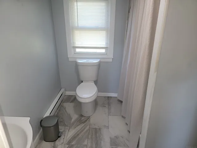 a bathroom with a toilet and a sink