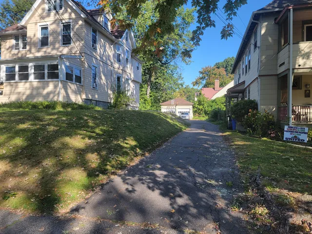 a view of a building with a yard