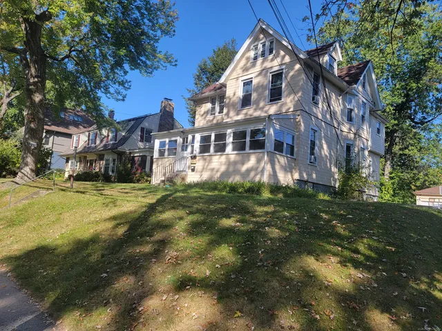 a view of a building with a yard