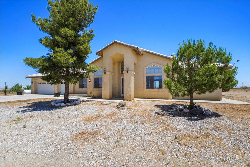 13075 Gitano Road Phelan, CA 92371 - Photo 1 of 1 a front view of a house with a yard