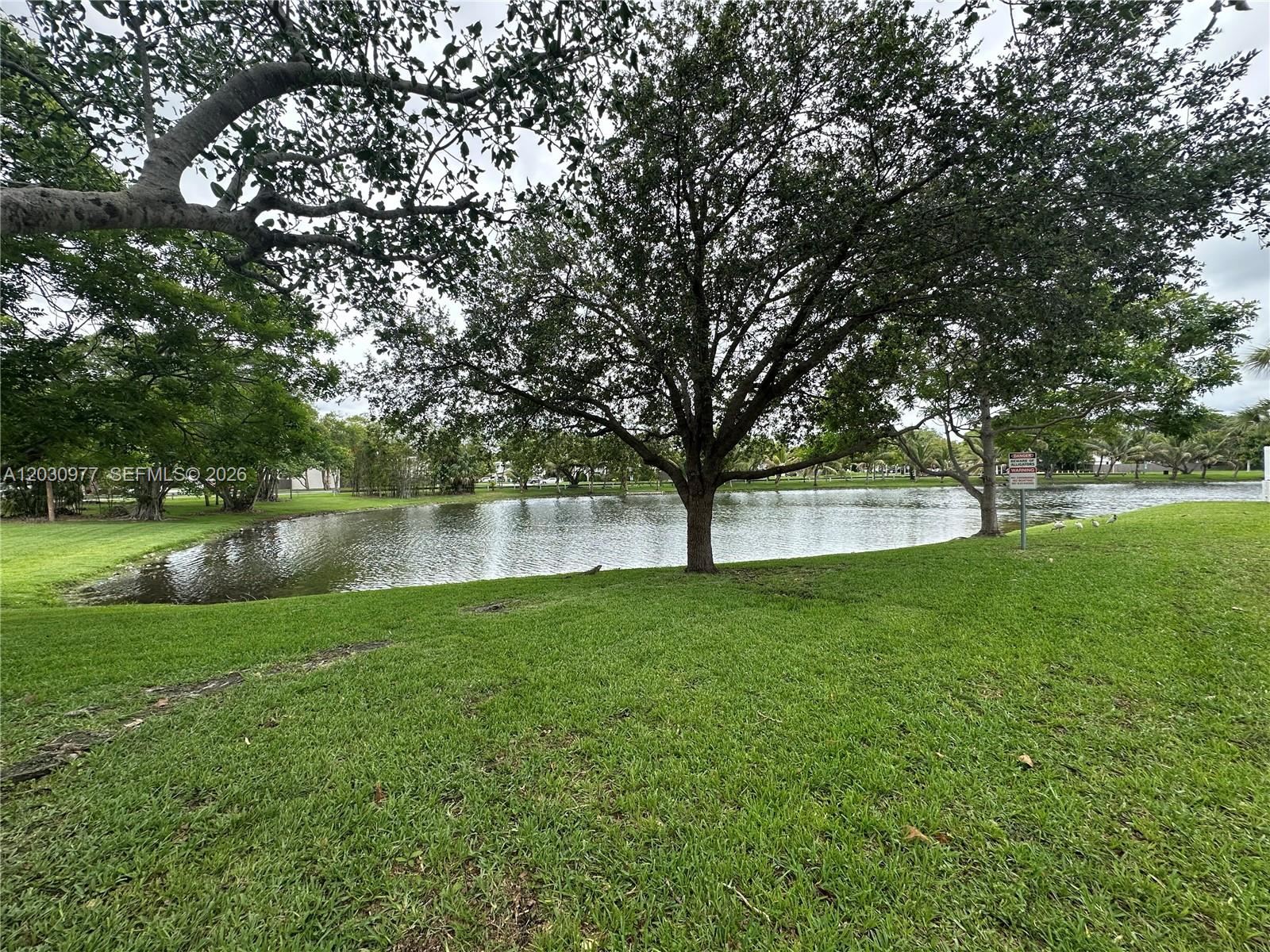 11358 Southwest 68th Terrace Miami, FL 33173 - Photo 2 of 8 Lots of greenery throughout complex