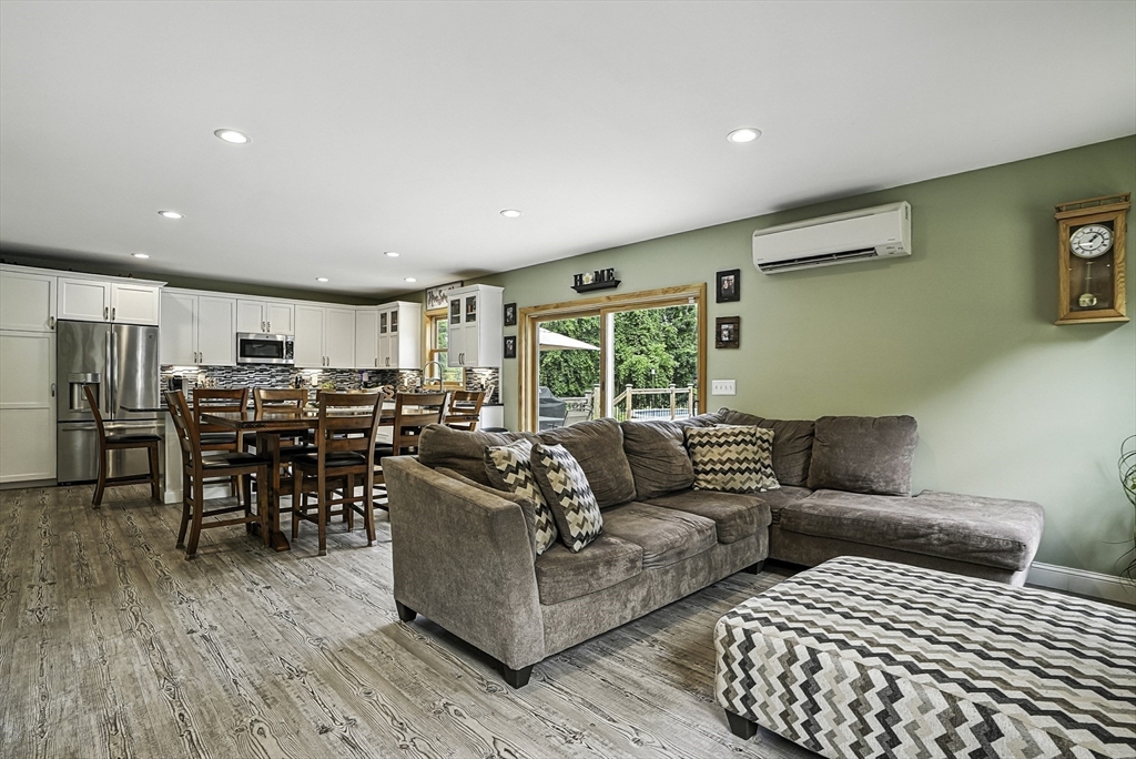 133 Rowley Hill Road Sterling, MA 01564 - Photo 13 of 41 a living room with furniture and a large window