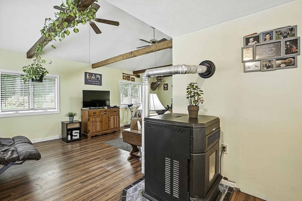 133 Rowley Hill Road Sterling, MA 01564 - Photo 17 of 41 a living room with furniture and a flat screen tv