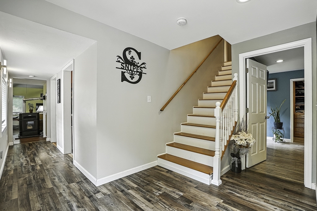 133 Rowley Hill Road Sterling, MA 01564 - Photo 21 of 41 a view of a livingroom with wooden floor and stairs