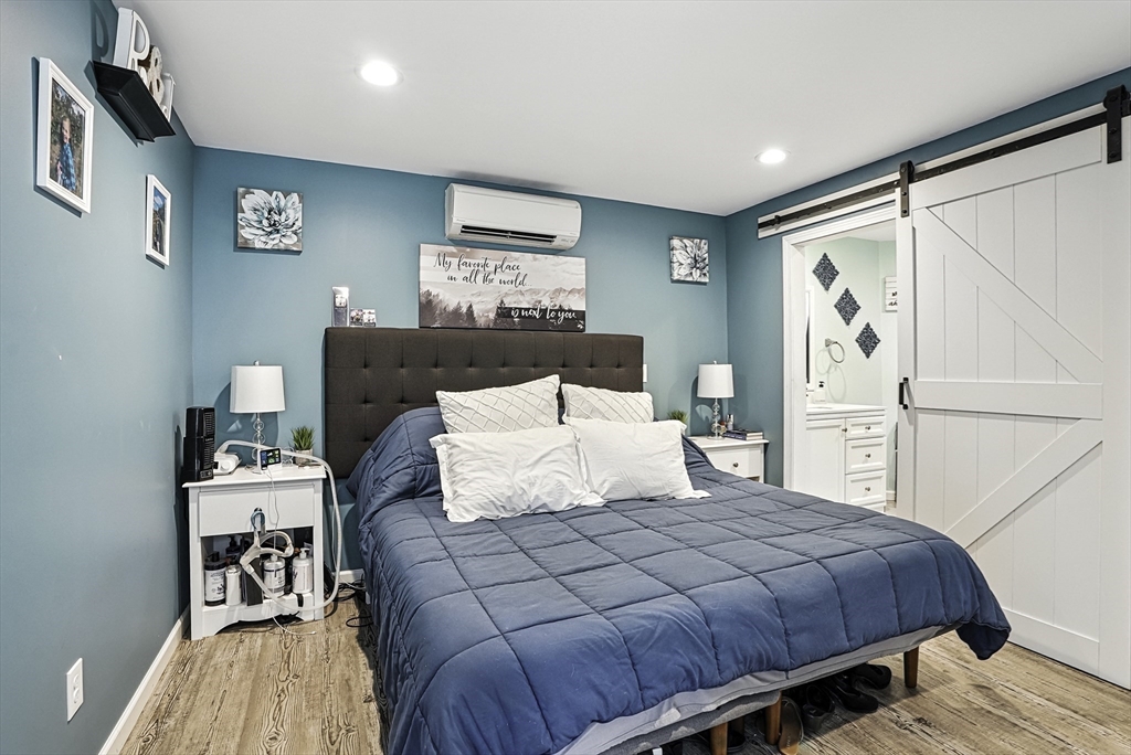 133 Rowley Hill Road Sterling, MA 01564 - Photo 30 of 41 a bedroom with a large bed and a table