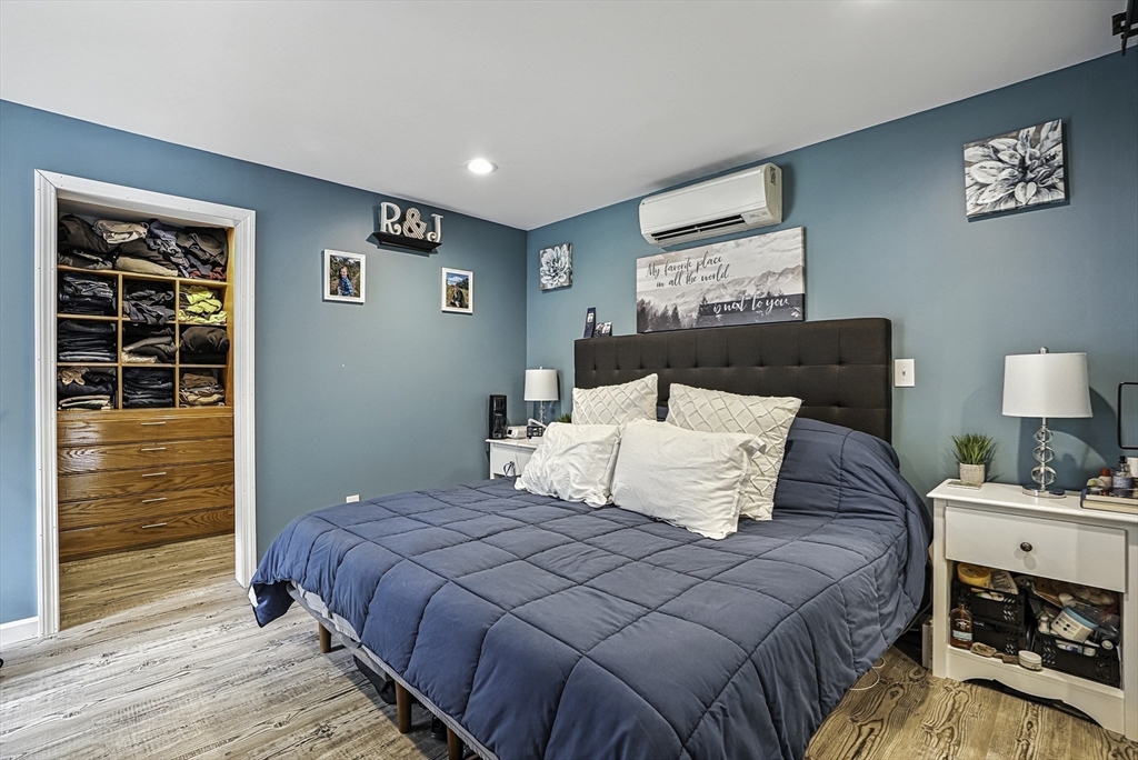 133 Rowley Hill Road Sterling, MA 01564 - Photo 31 of 41 a bedroom with a bed and wooden floor
