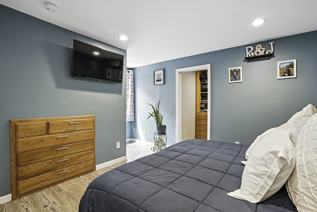 133 Rowley Hill Road Sterling, MA 01564 - Photo 32 of 41 a bedroom with a bed and a television