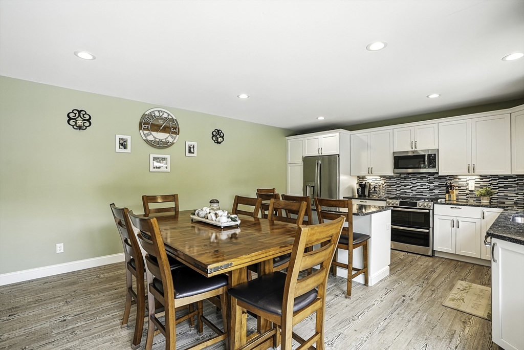 133 Rowley Hill Road Sterling, MA 01564 - Photo 40 of 41 a view of a dining room with furniture and wooden floor
