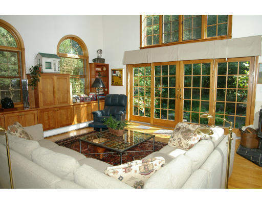 40 Middleby Road Lexington, MA 02421 - Photo 1 of 6 a living room with fireplace furniture and a large window