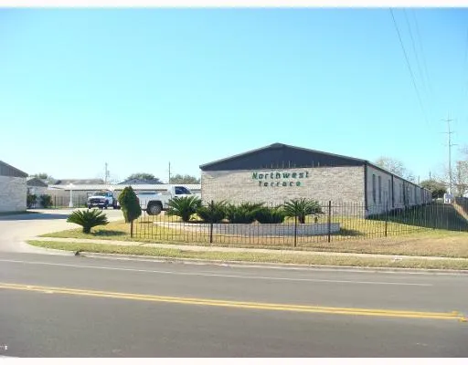 a view of a swimming pool with a house