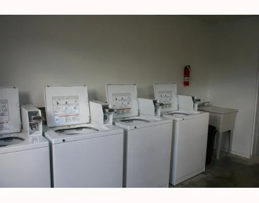a kitchen that has a sink and a stove