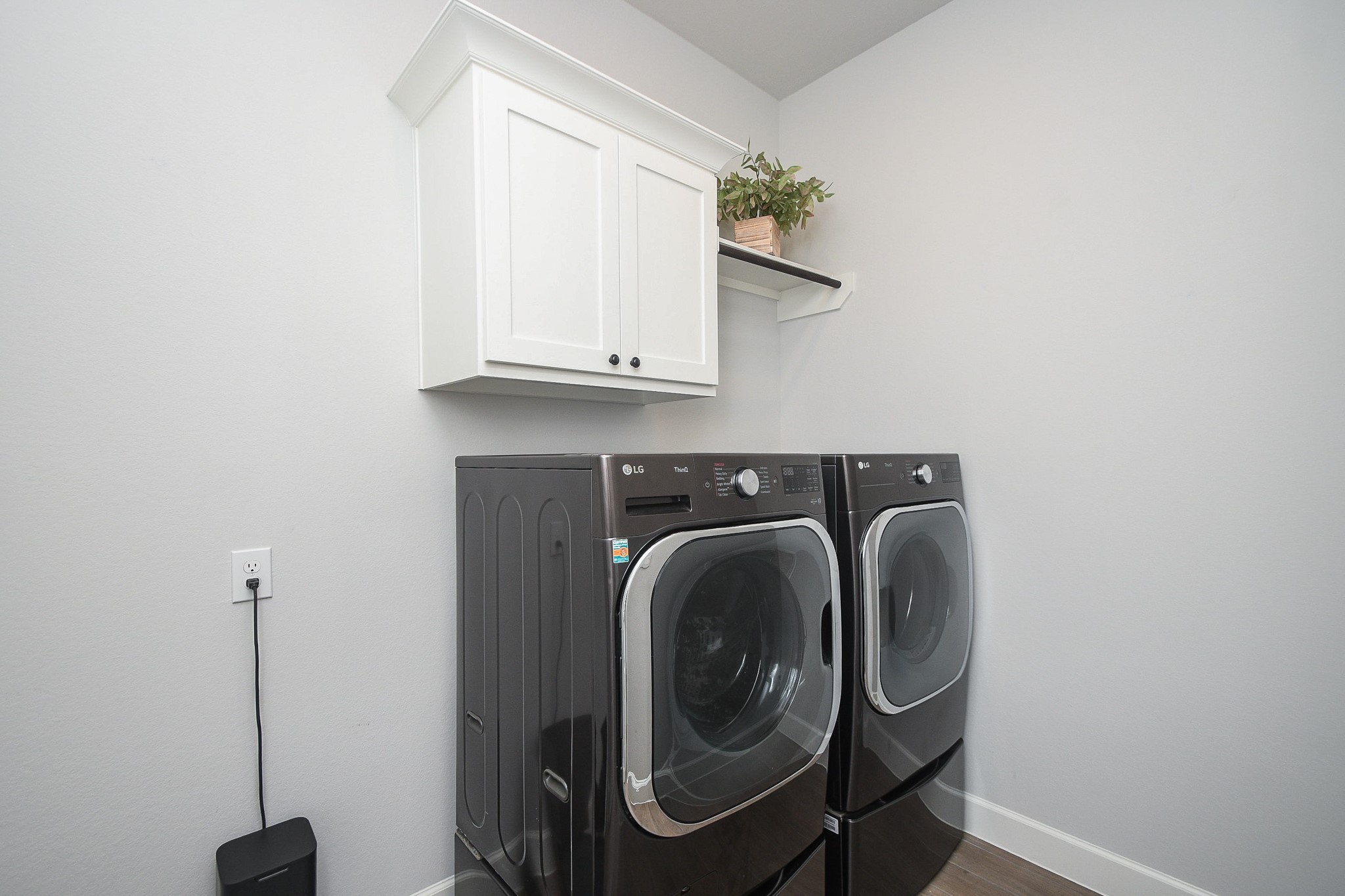 30314 Brook Point Fulshear, TX 77441 - Photo 33 of 38 Laundry room with storage and refrigerator space