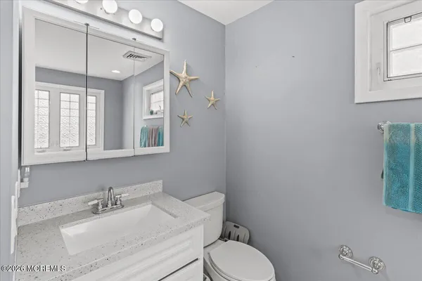 a bathroom with a bathtub and window