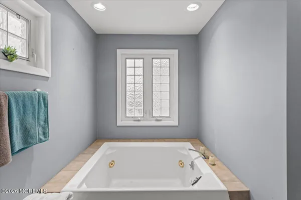 a bathroom with a glass shower door