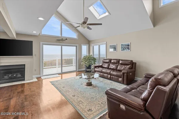 a living room with furniture and kitchen view
