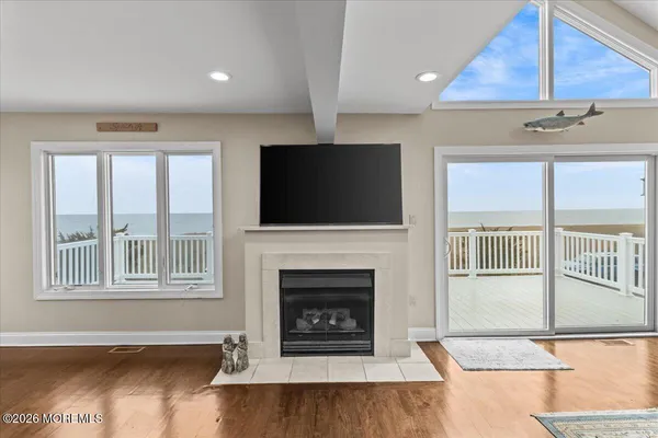 a kitchen with stainless steel appliances granite countertop a sink a stove and a wooden cabinets