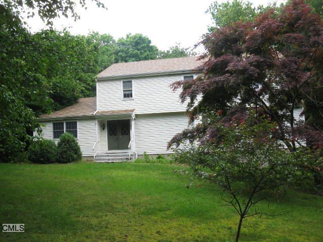 25 Jade Tree Lane Trumbull, CT 06611 - Photo 1 of 1 a front view of a house with a garden