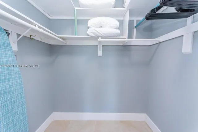 a kitchen with granite countertop a stove and a microwave