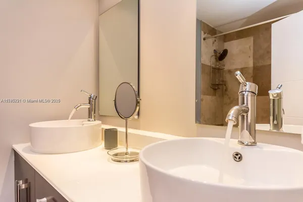 a kitchen with a sink and a stove top oven