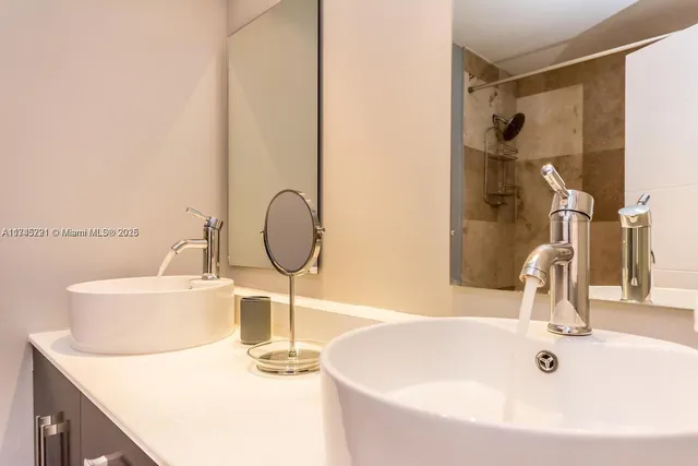 a kitchen with a sink and a stove top oven