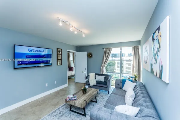 a view of a swimming pool with a garden and plants