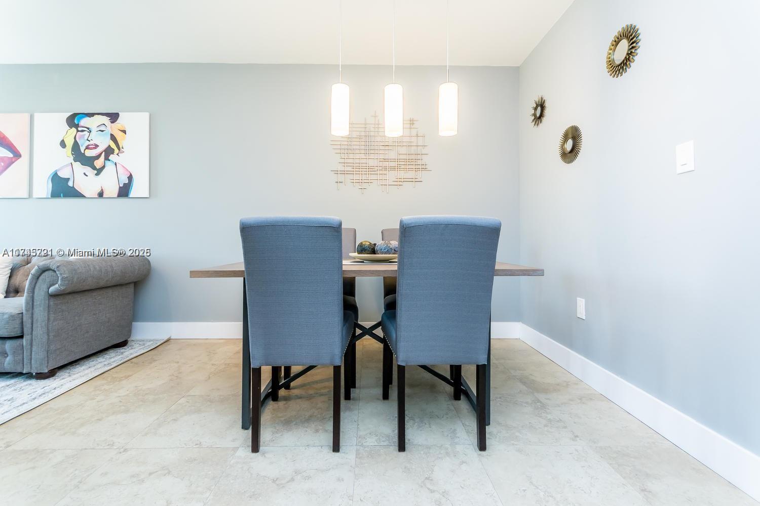 17620 Atlantic Boulevard, Unit 519 Sunny Isles Beach, FL 33160 - Photo 26 of 33 a view of a workspace with furniture and a window
