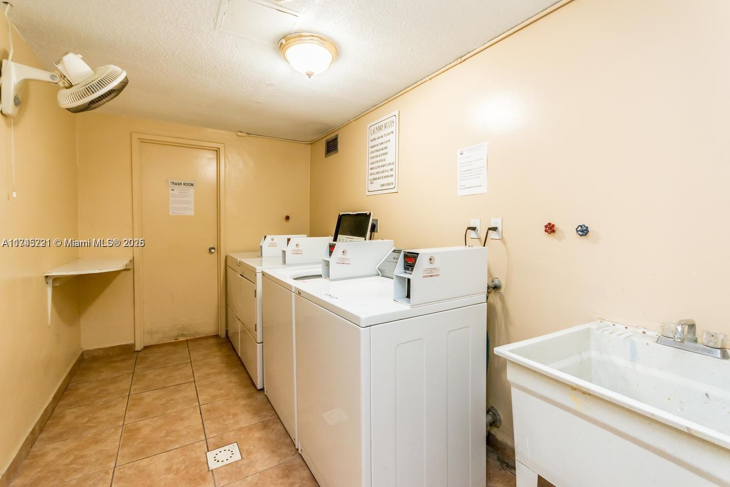 17620 Atlantic Boulevard, Unit 519 Sunny Isles Beach, FL 33160 - Photo 28 of 33 a utility room with dryer and washer