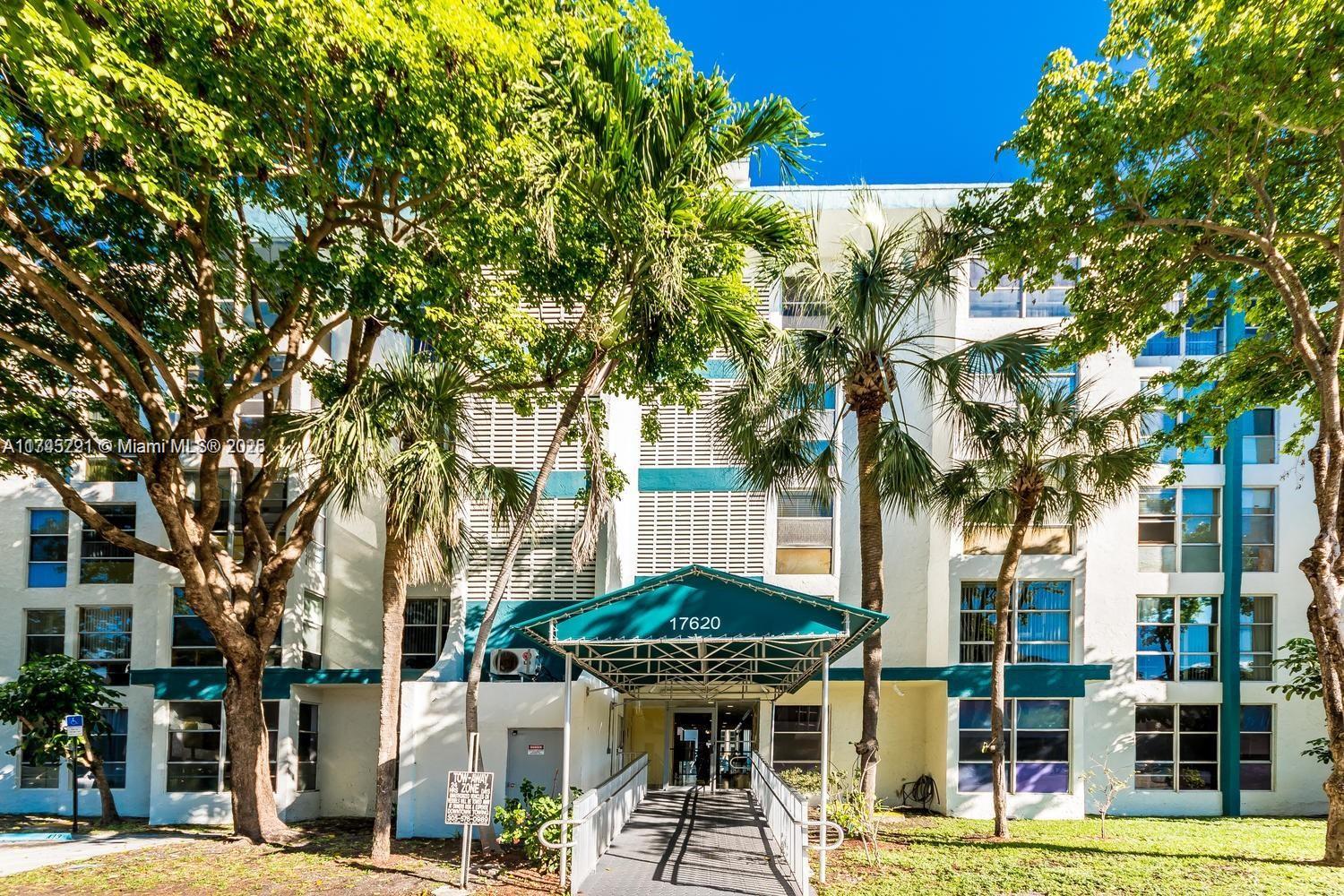 17620 Atlantic Boulevard, Unit 519 Sunny Isles Beach, FL 33160 - Photo 29 of 33 a view of a building with a tree