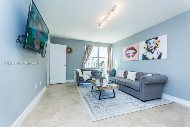 a living room with furniture and a table