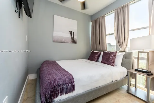 a bathroom with a toilet and a mirror