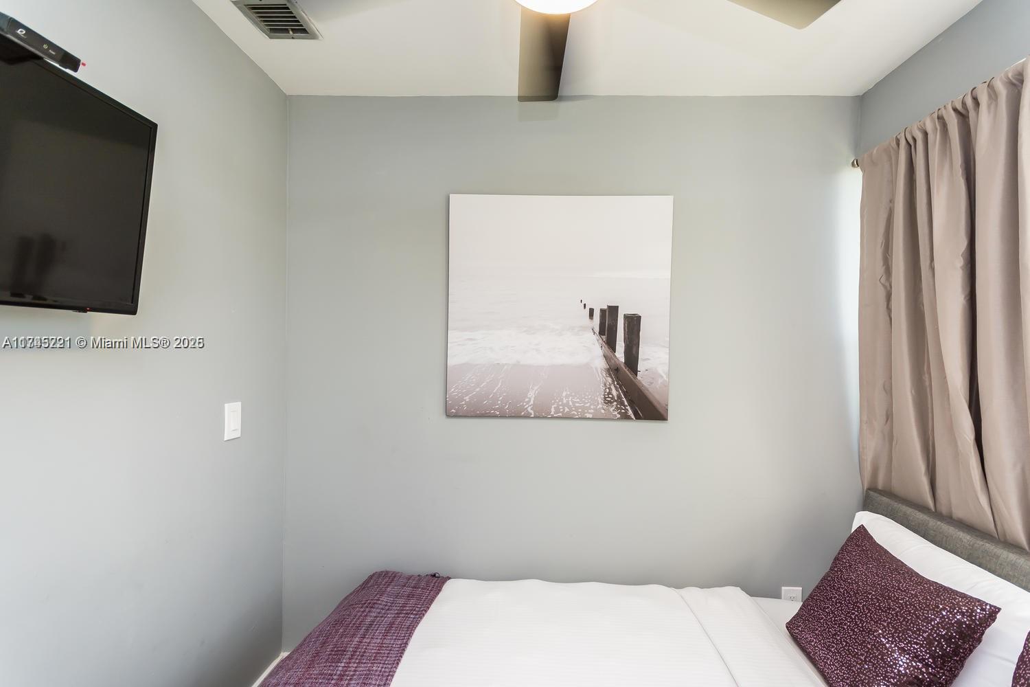 17620 Atlantic Boulevard, Unit 519 Sunny Isles Beach, FL 33160 - Photo 8 of 33 a bathroom with a toilet and a mirror