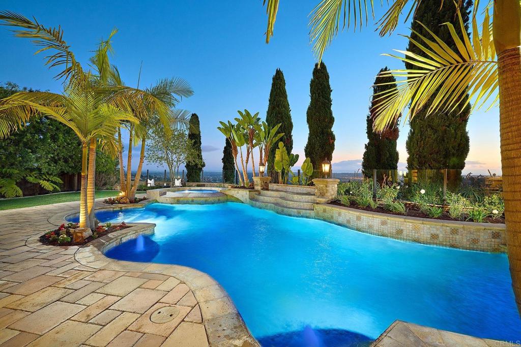 6921 Corte Langosta Carlsbad, CA 92009 - Photo 2 of 20 a view of a backyard with swimming pool