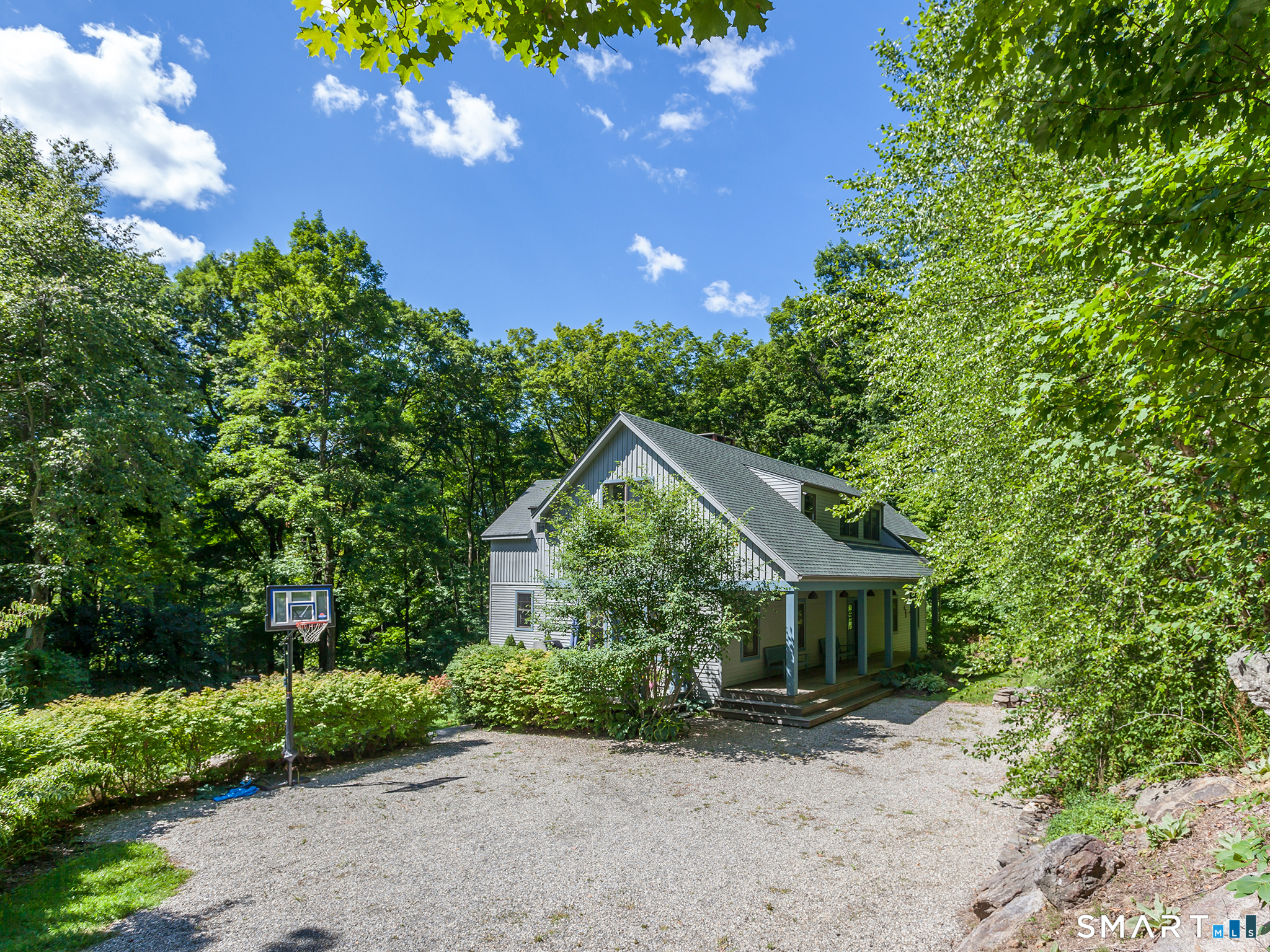 68 Hopkins Road Warren, CT 06777 - Photo 23 of 30 a front view of a house with a garden
