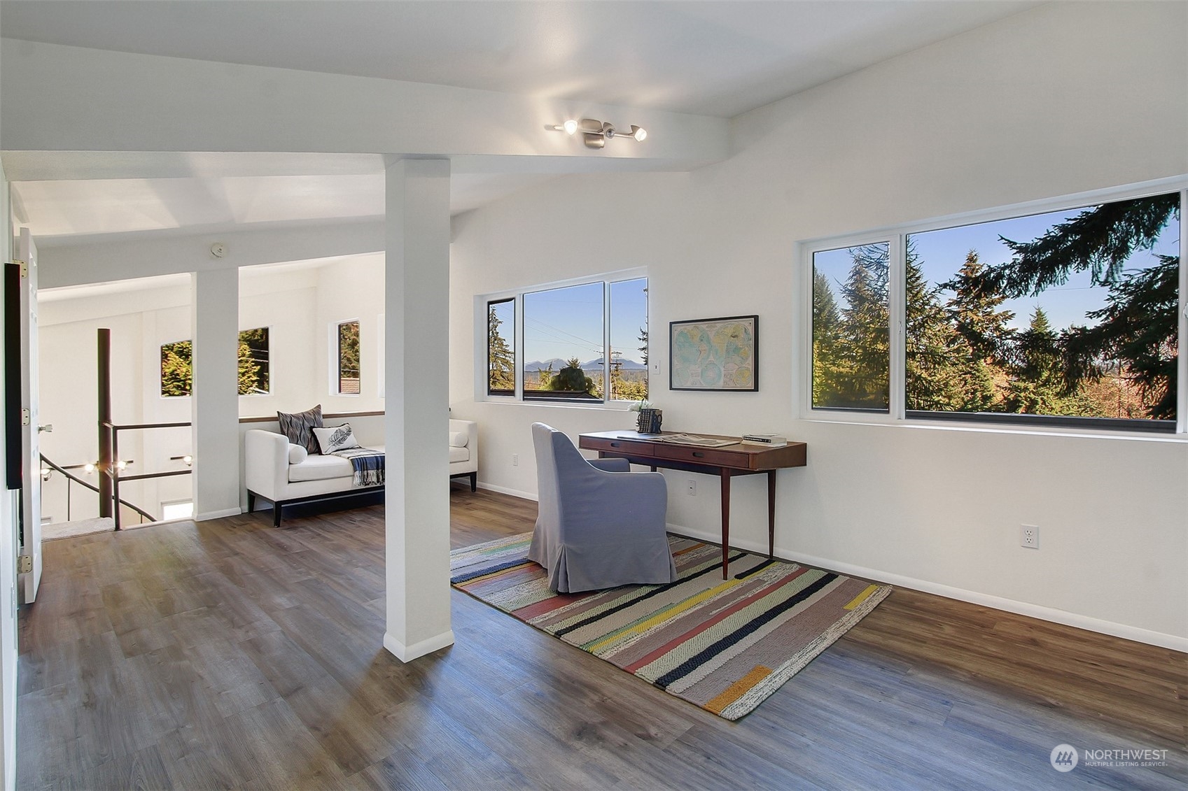 21606 3rd Avenue Southeast Bothell, WA 98021 - Photo 26 of 38 a living room with furniture and a wooden floor