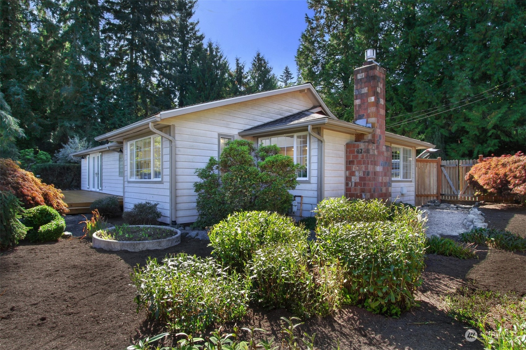 21606 3rd Avenue Southeast Bothell, WA 98021 - Photo 32 of 38 a view of a house with a yard and plants