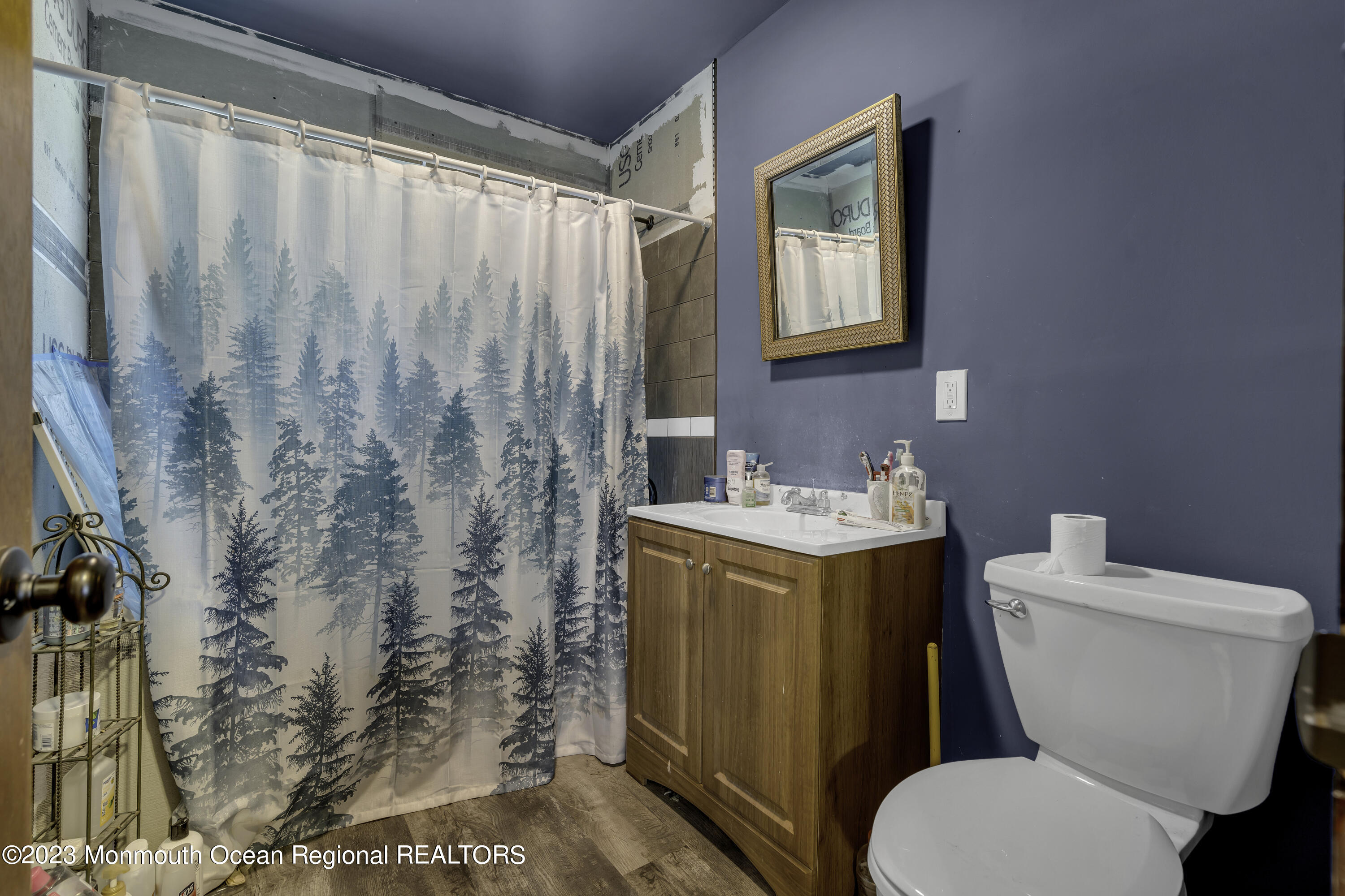 856 Bowman Road Jackson, NJ 08527 - Photo 12 of 21 a white toilet sitting next to a bathroom sink