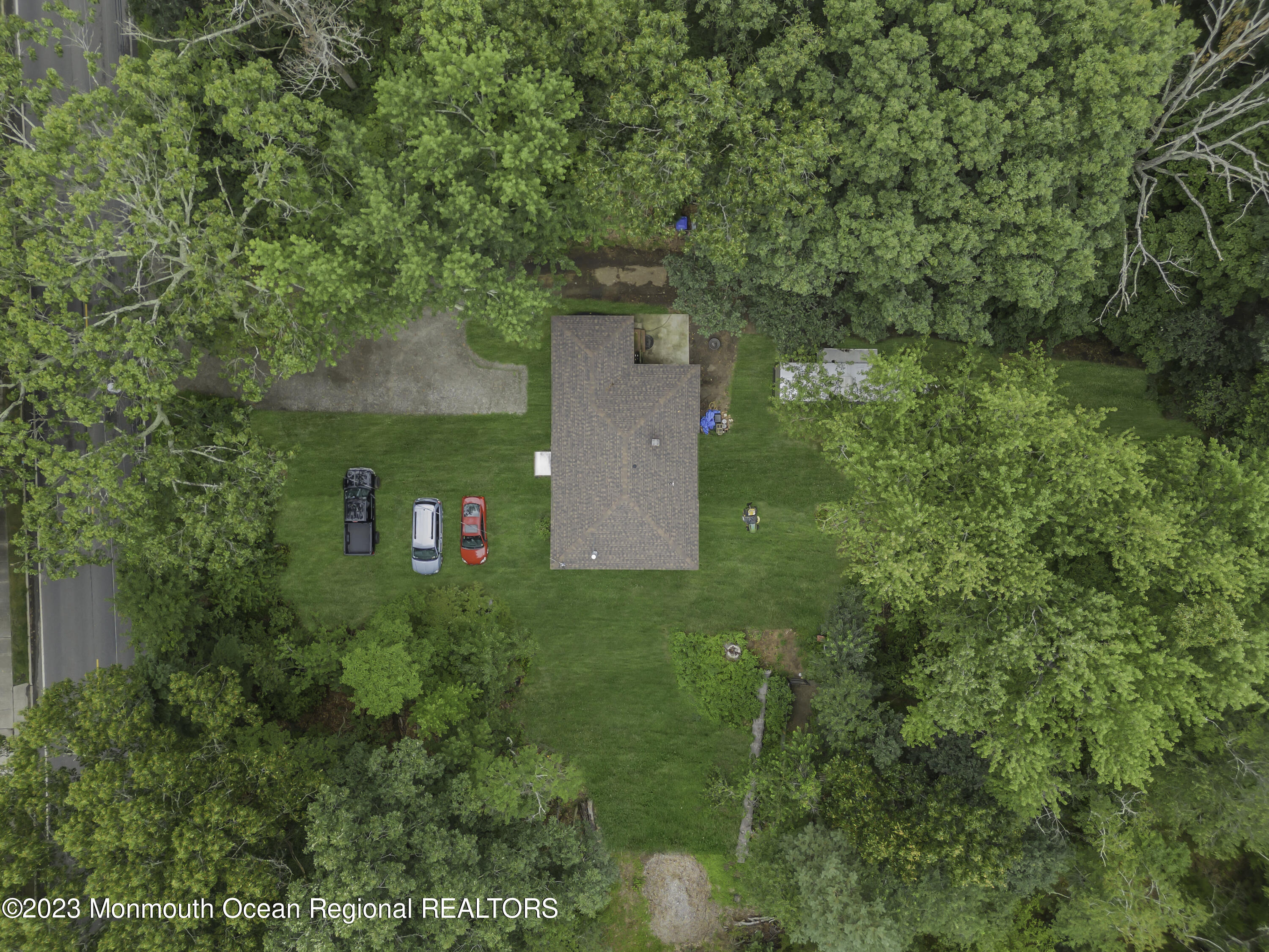 856 Bowman Road Jackson, NJ 08527 - Photo 16 of 21 an aerial view of a house with a yard and trees all around