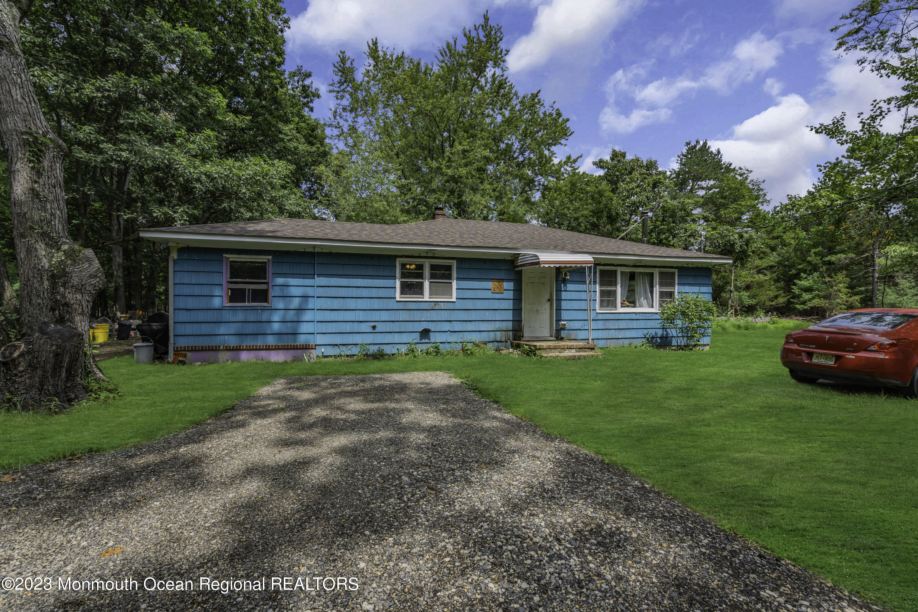 856 Bowman Road Jackson, NJ 08527 - Photo 3 of 21 a front view of a house with a garden