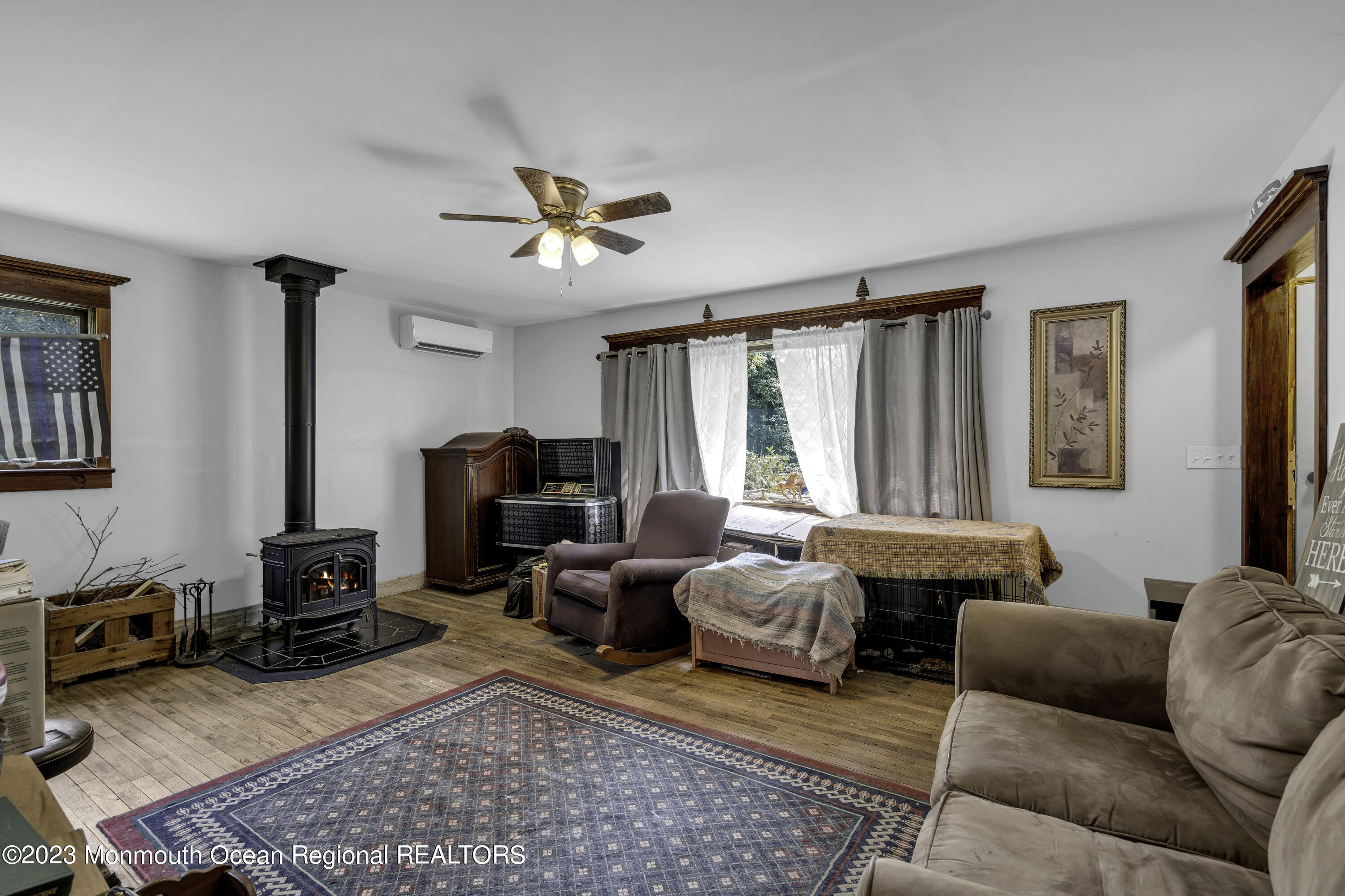 856 Bowman Road Jackson, NJ 08527 - Photo 5 of 21 a living room with furniture a rug and a window