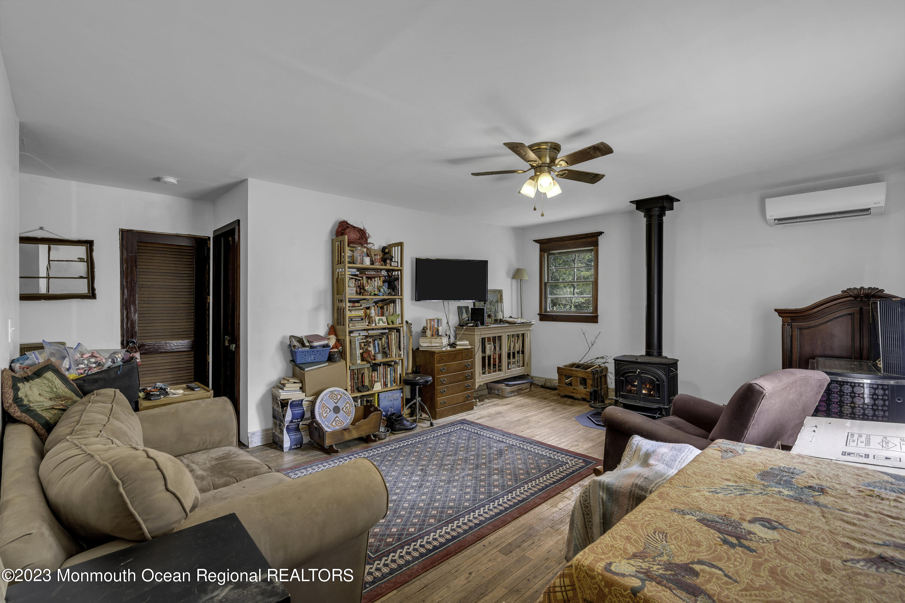 856 Bowman Road Jackson, NJ 08527 - Photo 6 of 21 a living room with furniture flat screen tv and a window