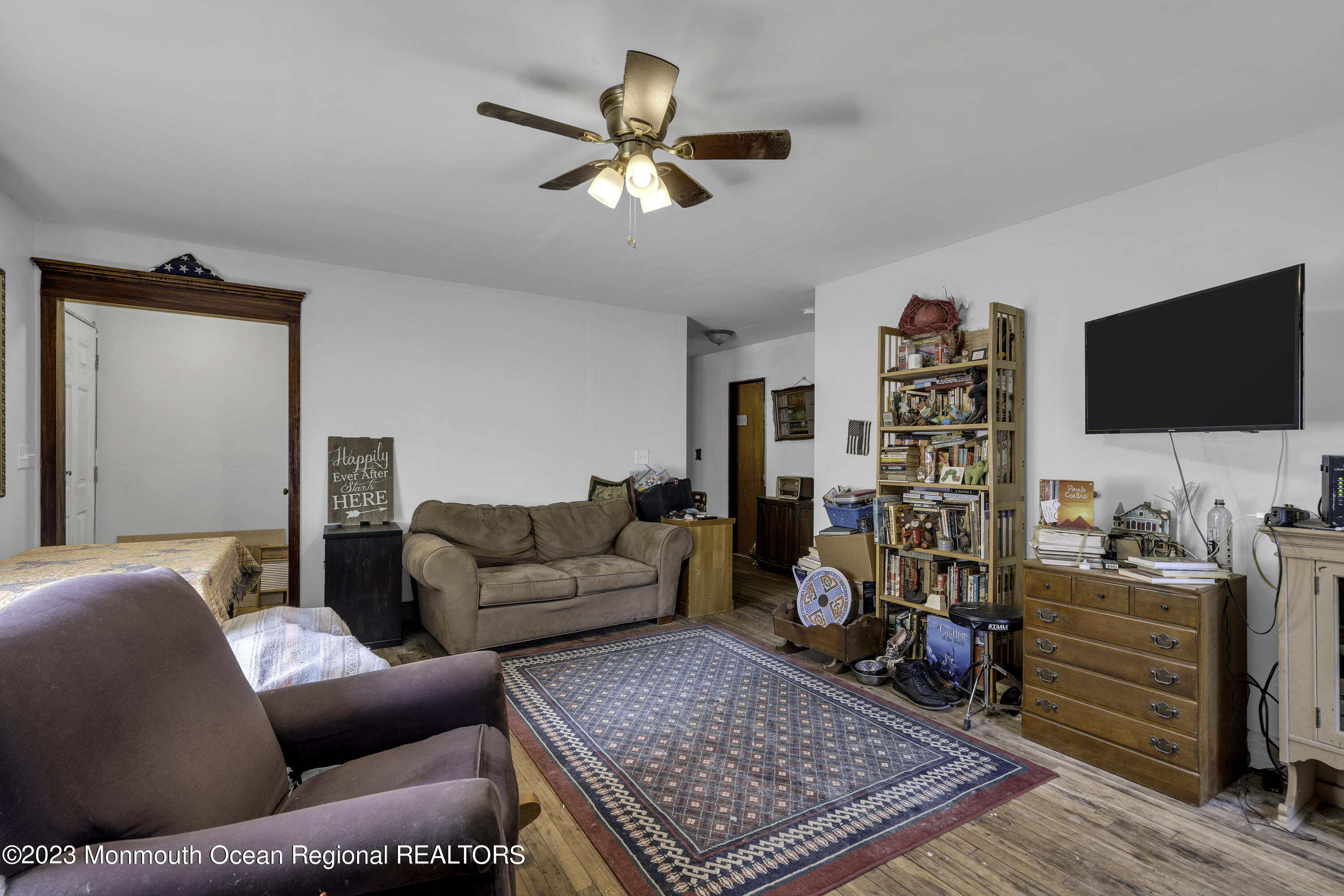 856 Bowman Road Jackson, NJ 08527 - Photo 8 of 21 a living room with furniture and a flat screen tv