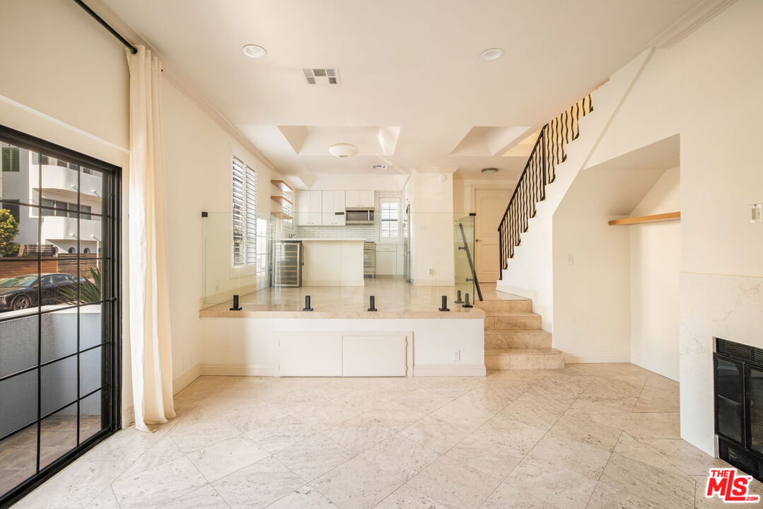 36 Navy Street, Unit 1 Venice, CA 90291 - Photo 1 of 49 a large white kitchen with a large window
